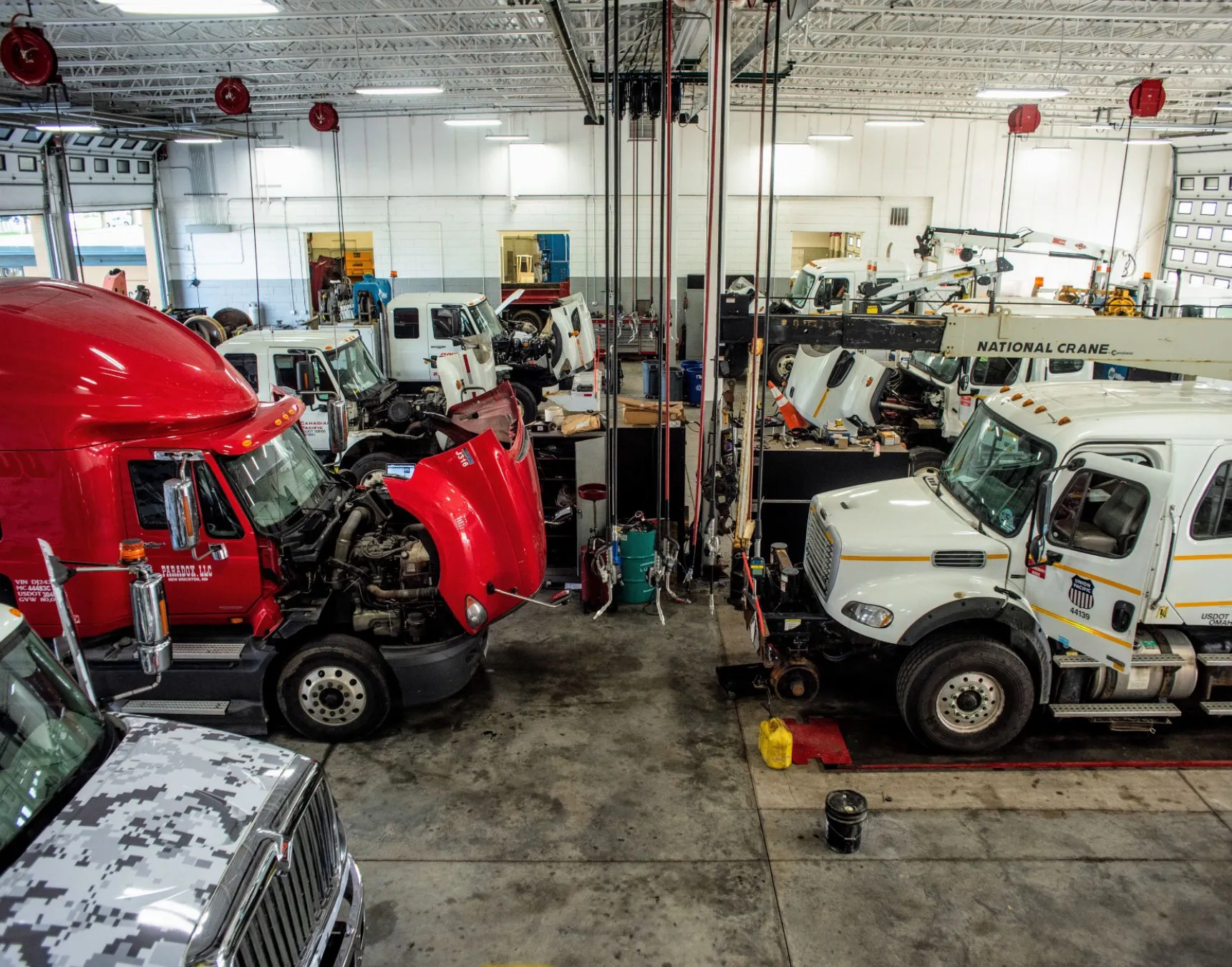 Commercial fleet vehicles being serviced